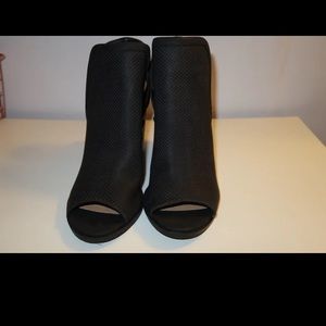Black Peep tie heel booties